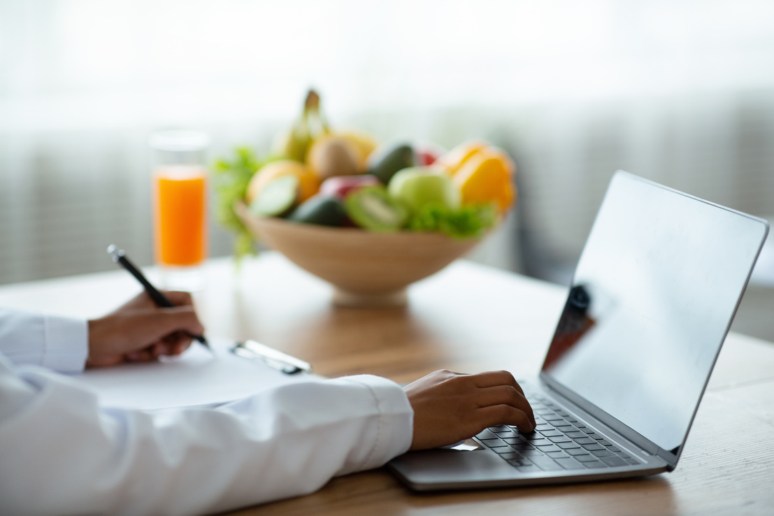 Healthy nutrition specialist giving online consultation, mockup for design on laptop screen